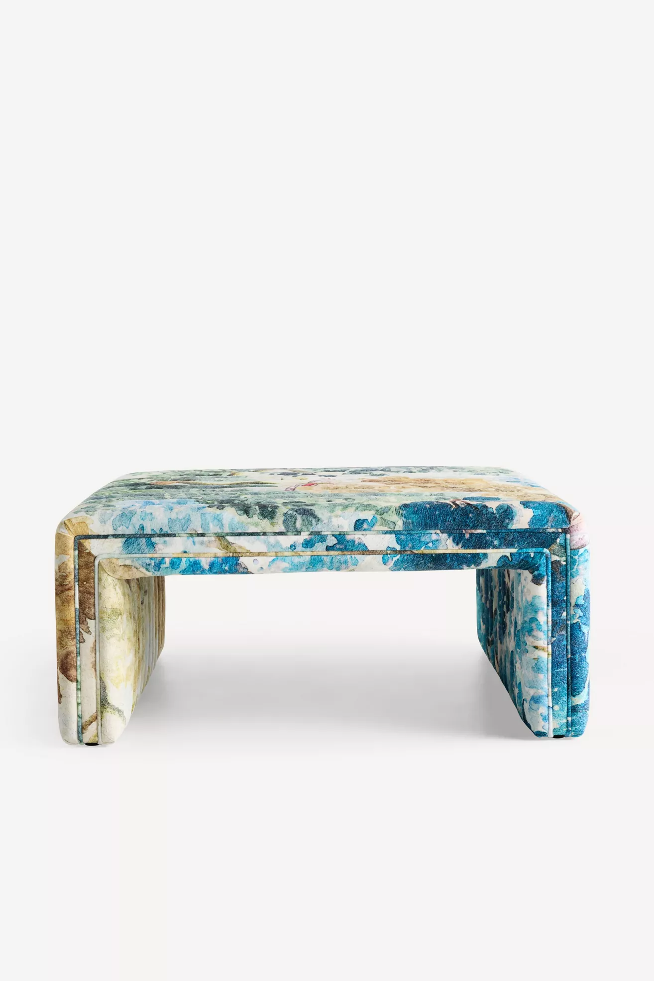 Front view of the Alexander coffee table ottoman showing its patterned upholstery