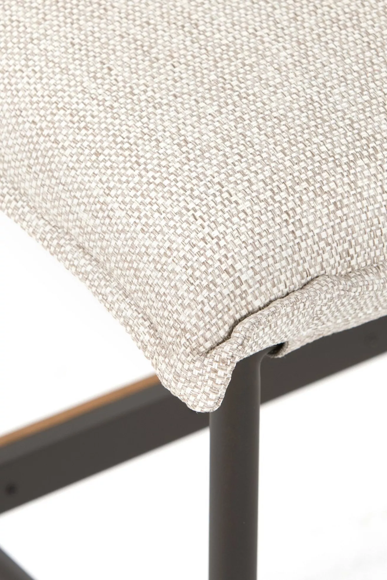 Beige textured cushion fabric close-up