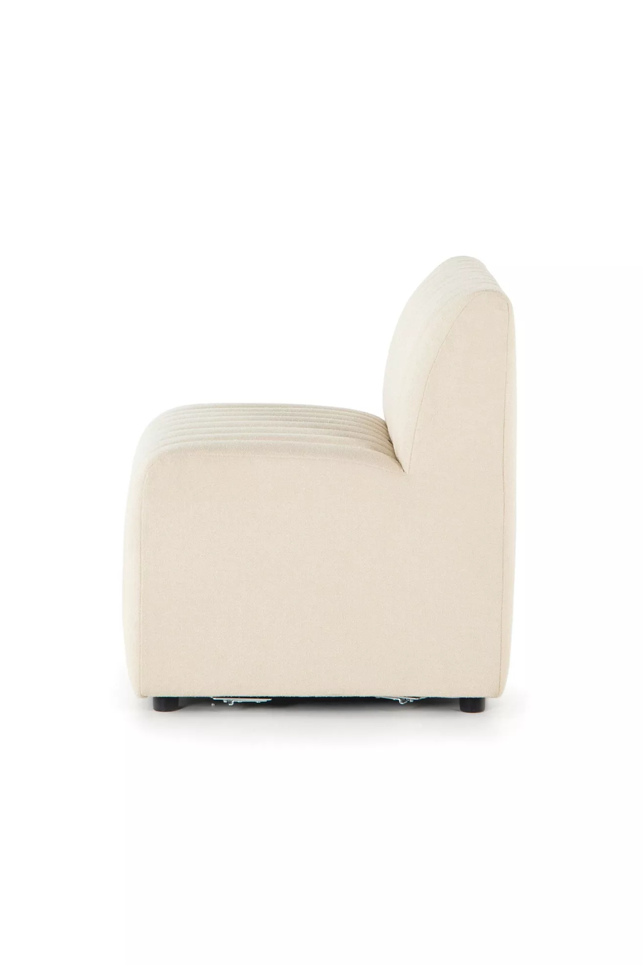 side view of cream armless chair focusing on base and feet