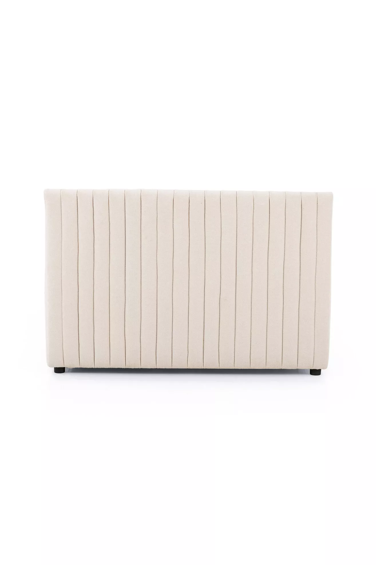 Cream upholstered dining bench back panel with vertical channel stitching and dark feet