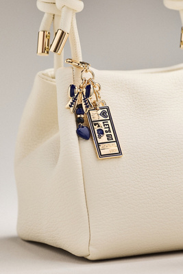 By Anthropologie Football Team Bag Charm In Purple