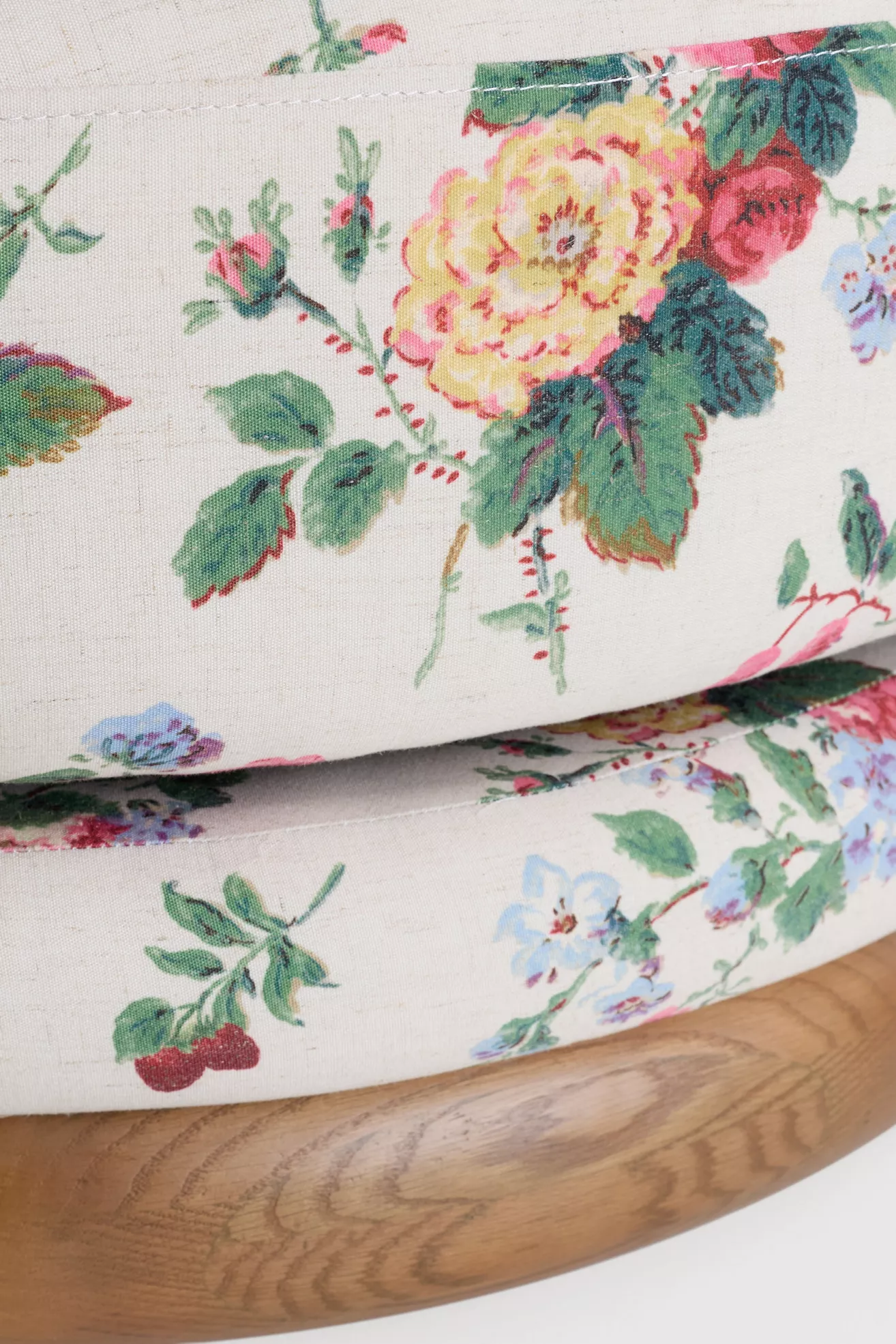 Close-up of floral fabric and wooden base