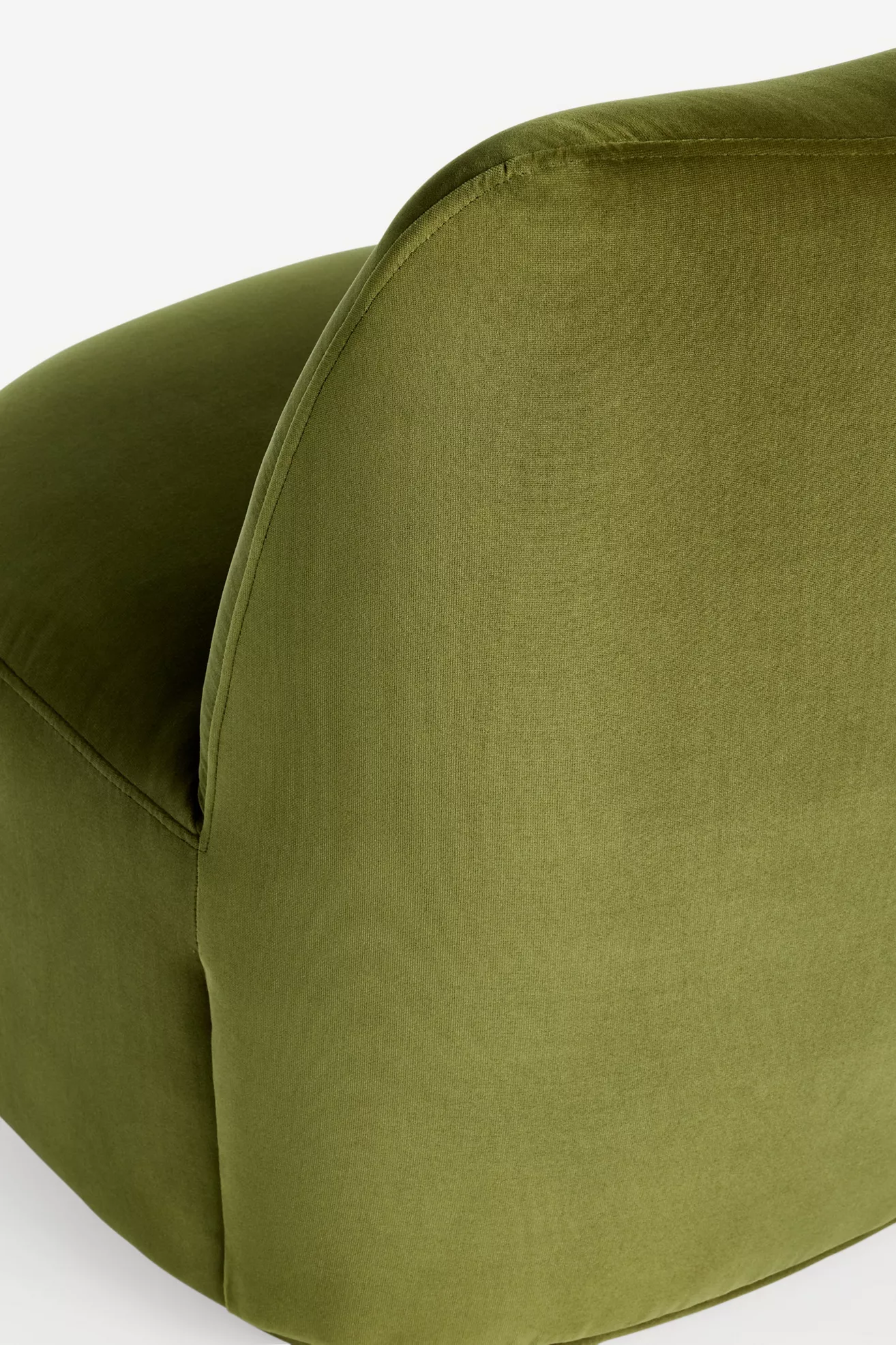 Close-up of olive-green velvet fabric on chair