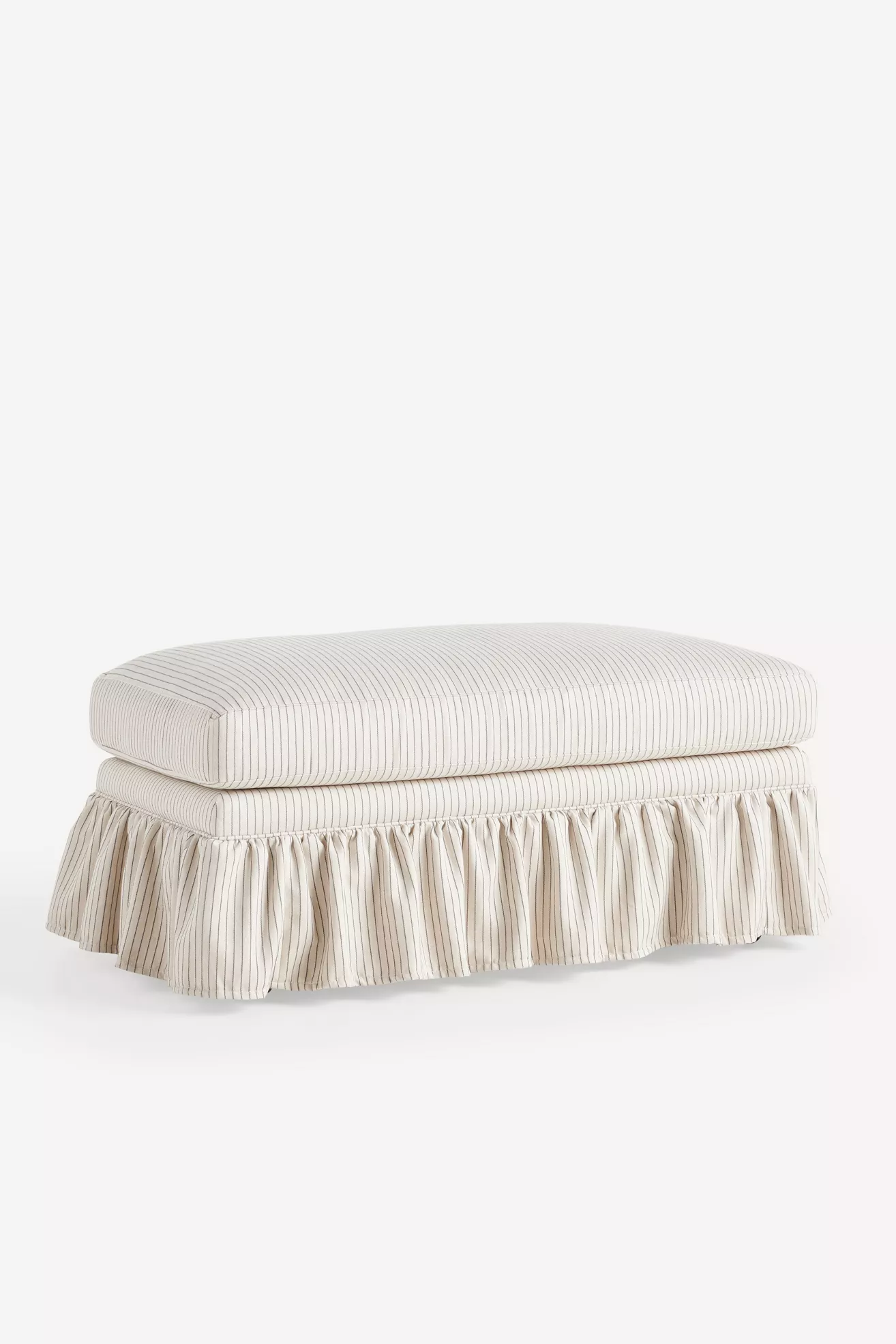 Beige striped ottoman with flat top cushion and draped skirt, side view