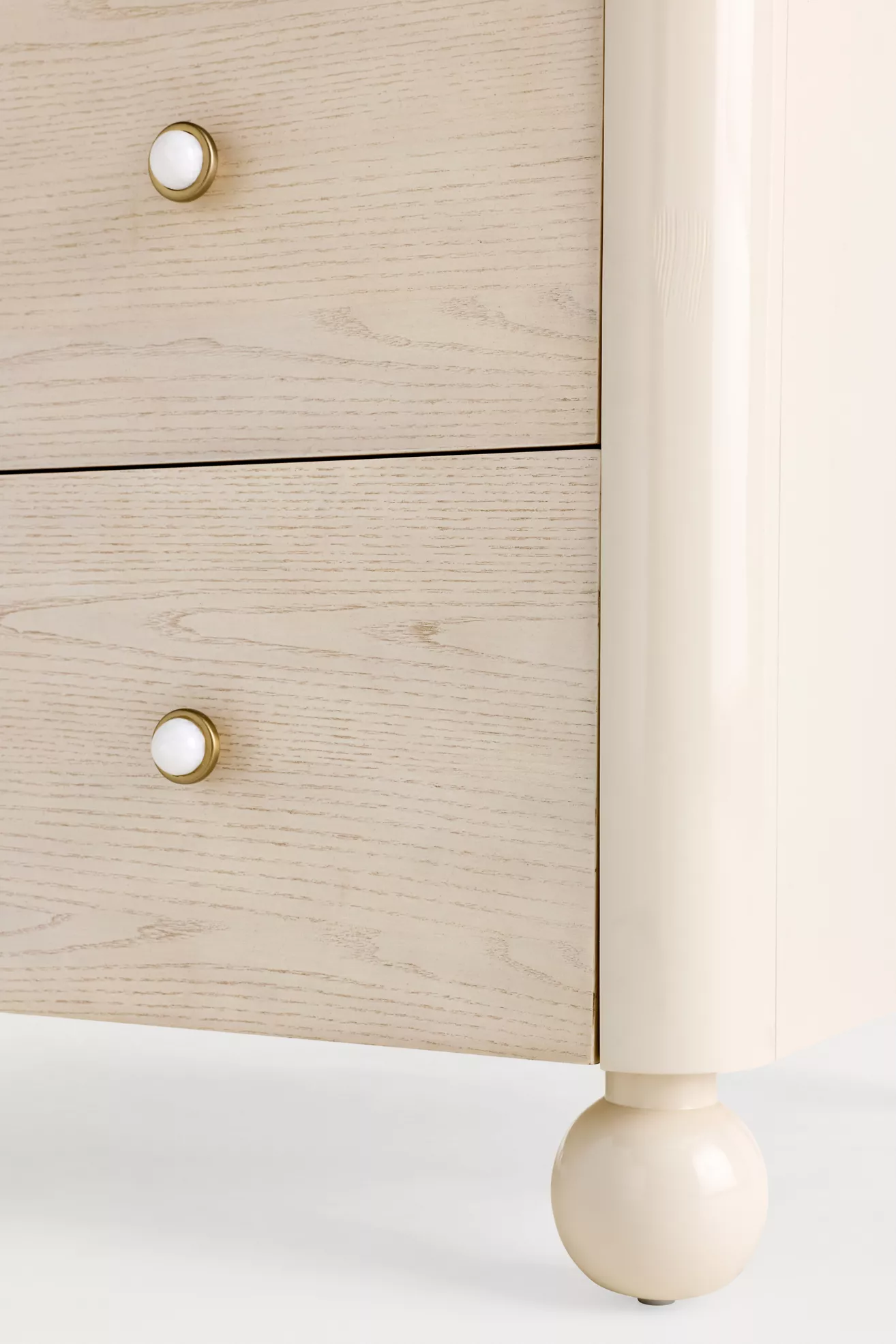 Close-up of drawer edge and leg with ball foot