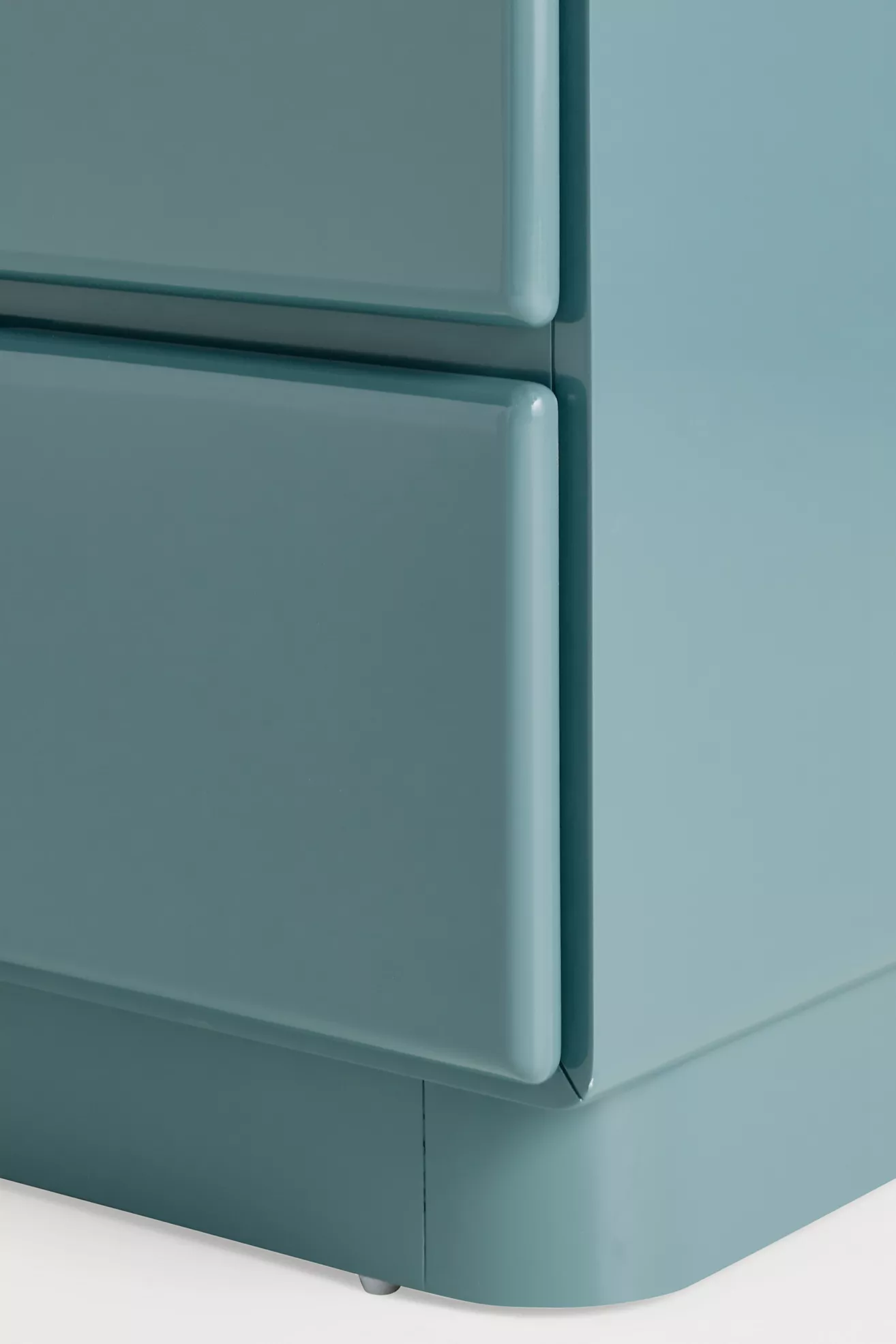 Close-up corner and base of dresser