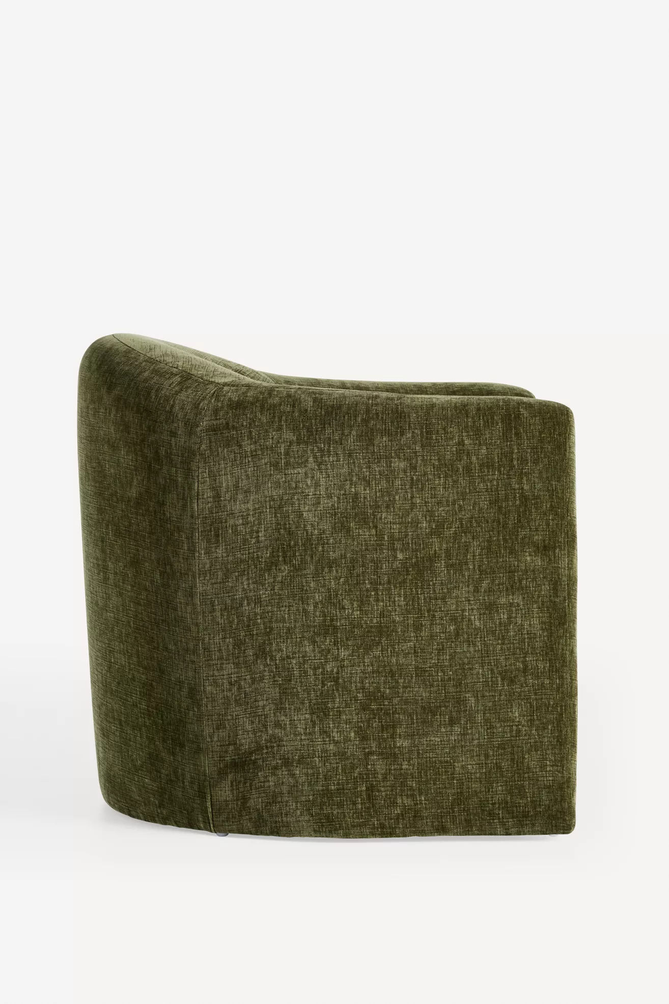 Side view of olive green velvet sculptural chair