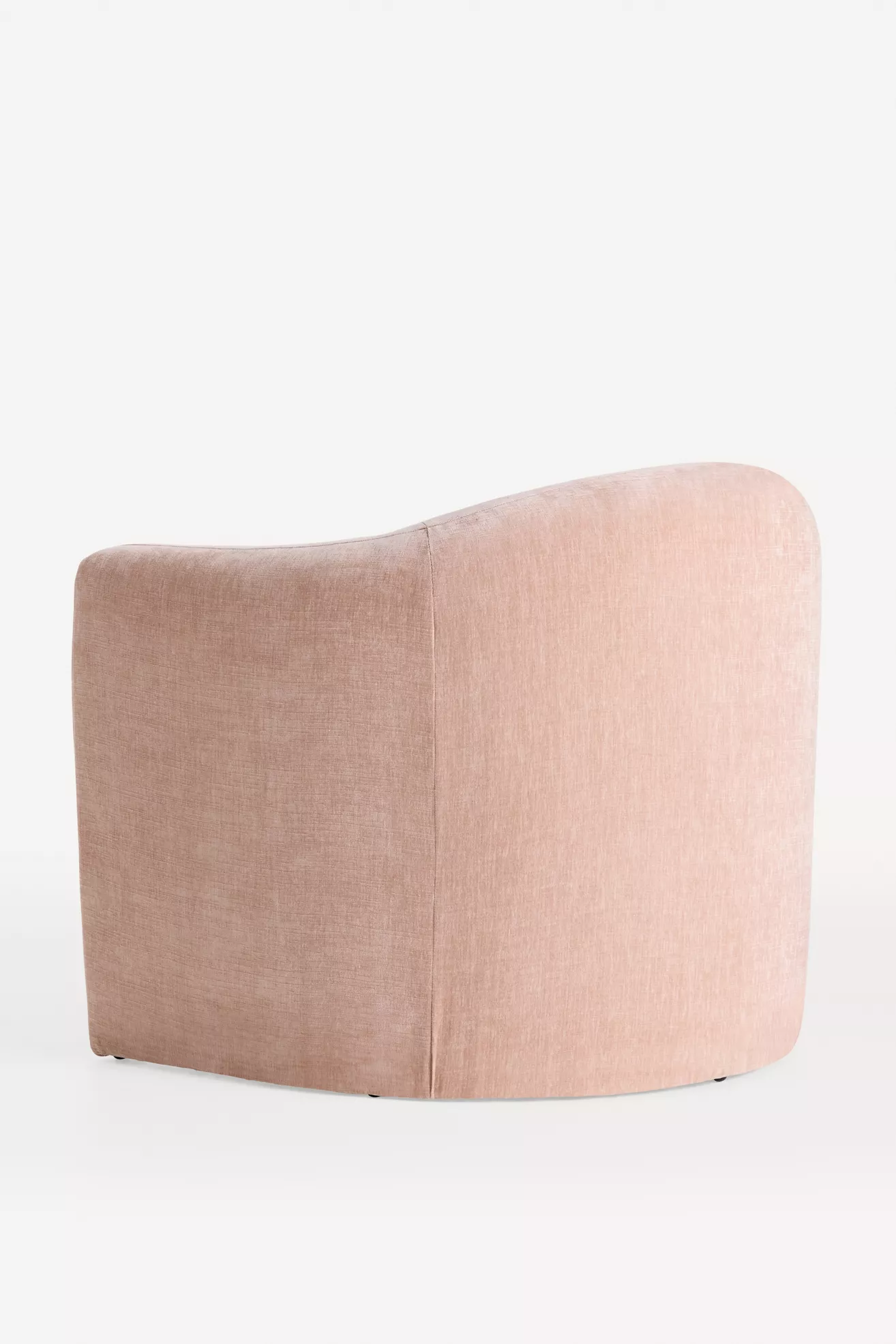 Rear/side angle of pink velvet sculptural chair