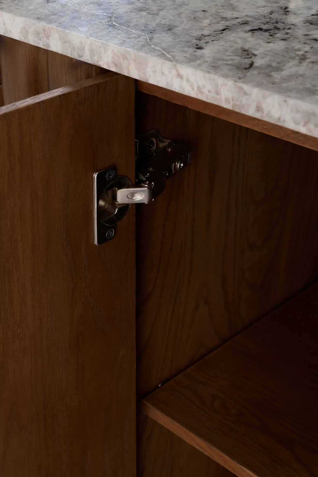 Hardware hinge and marble countertop edge