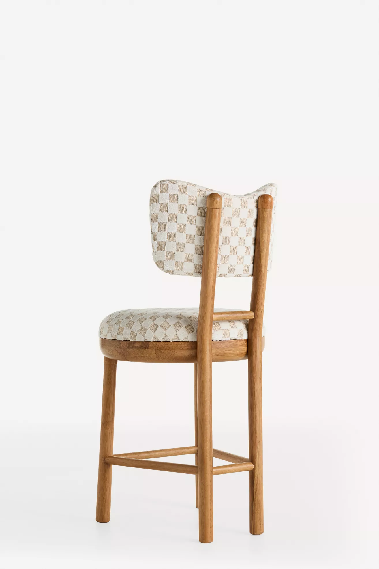 Rear/side view of stool showing backrest and legs