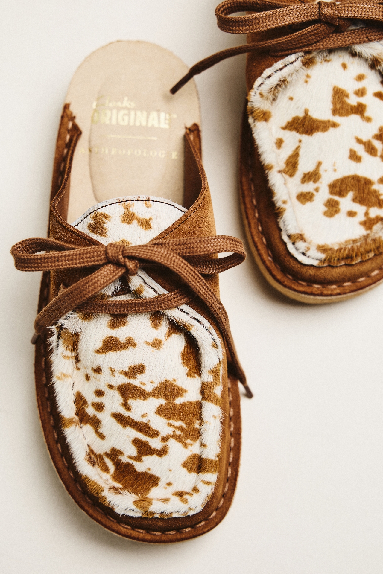 Clarks x Anthropologie Nomad Cow Print Mules