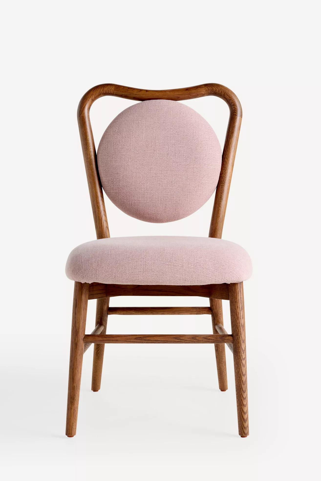 Front view of pink upholstered dining chair