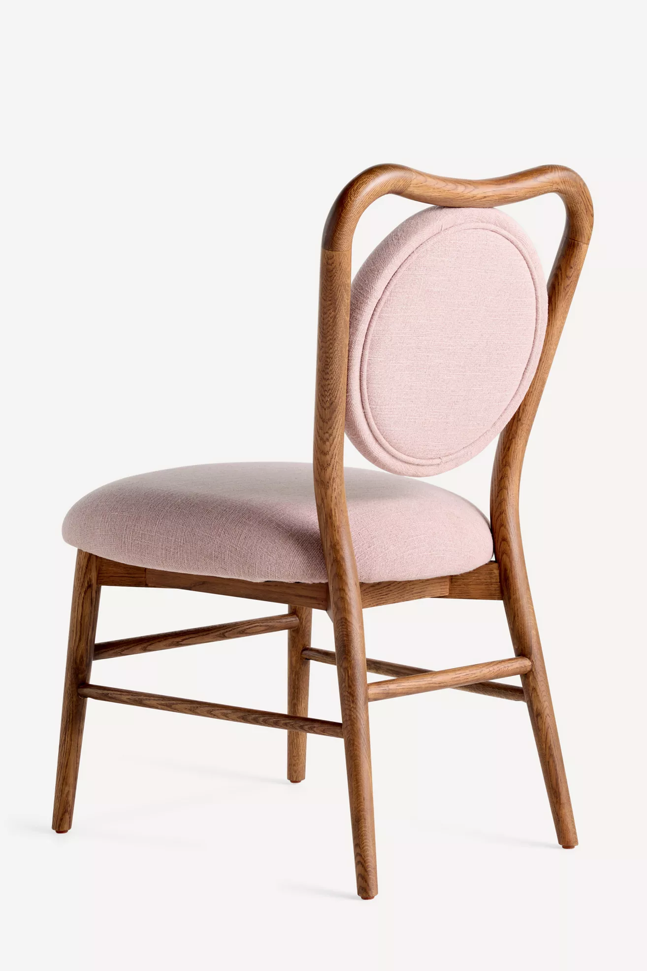 Angled view of chair with oval back cushion