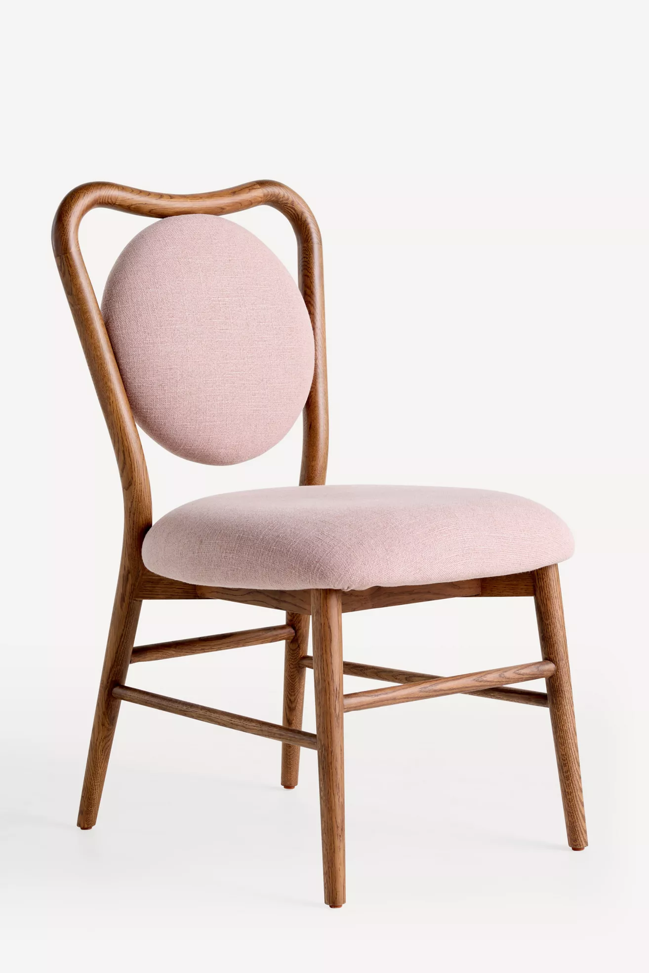 Close-up of pink upholstered dining chair back and seat