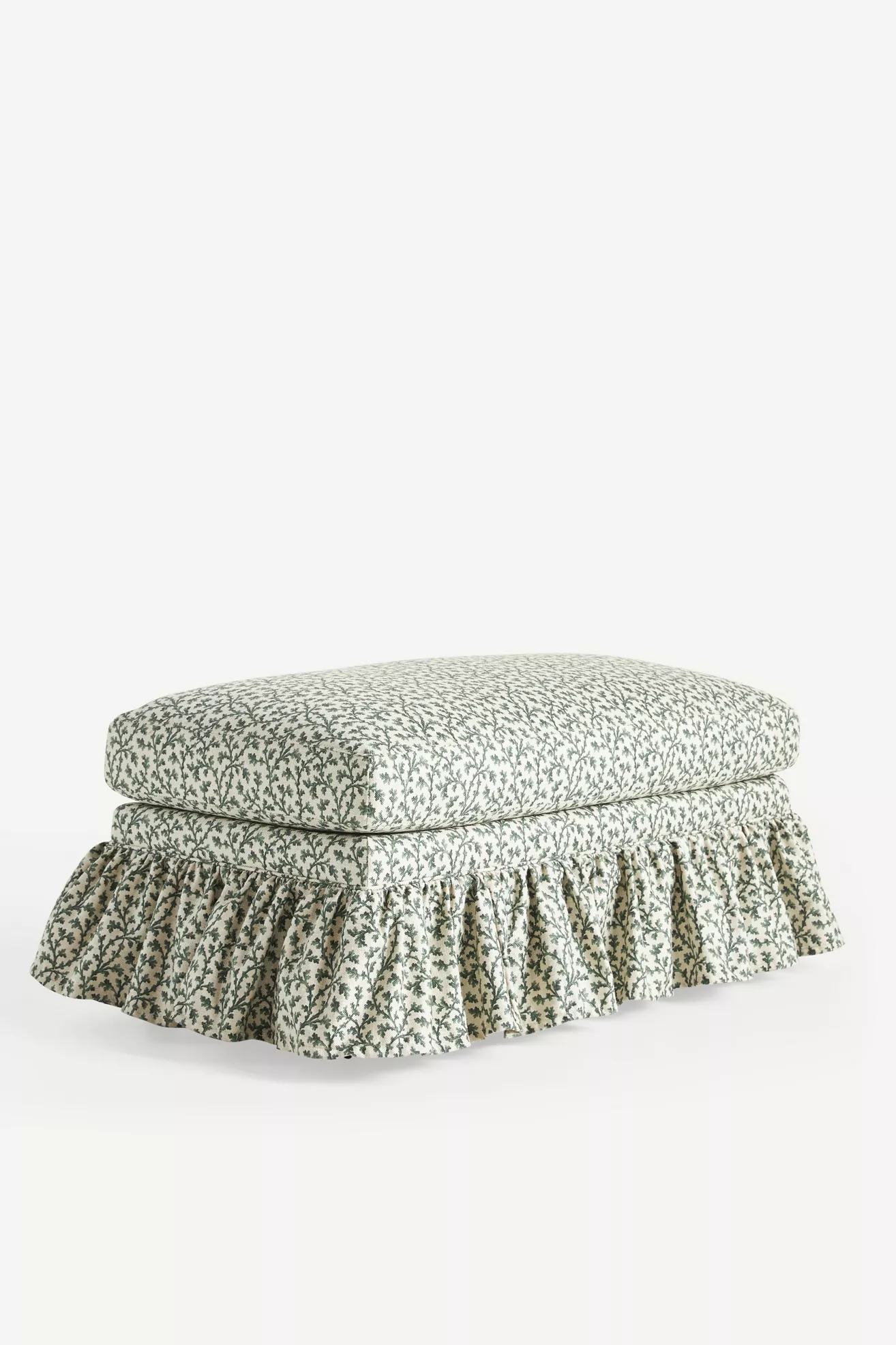 Ottoman with green botanical print and ruffled skirt