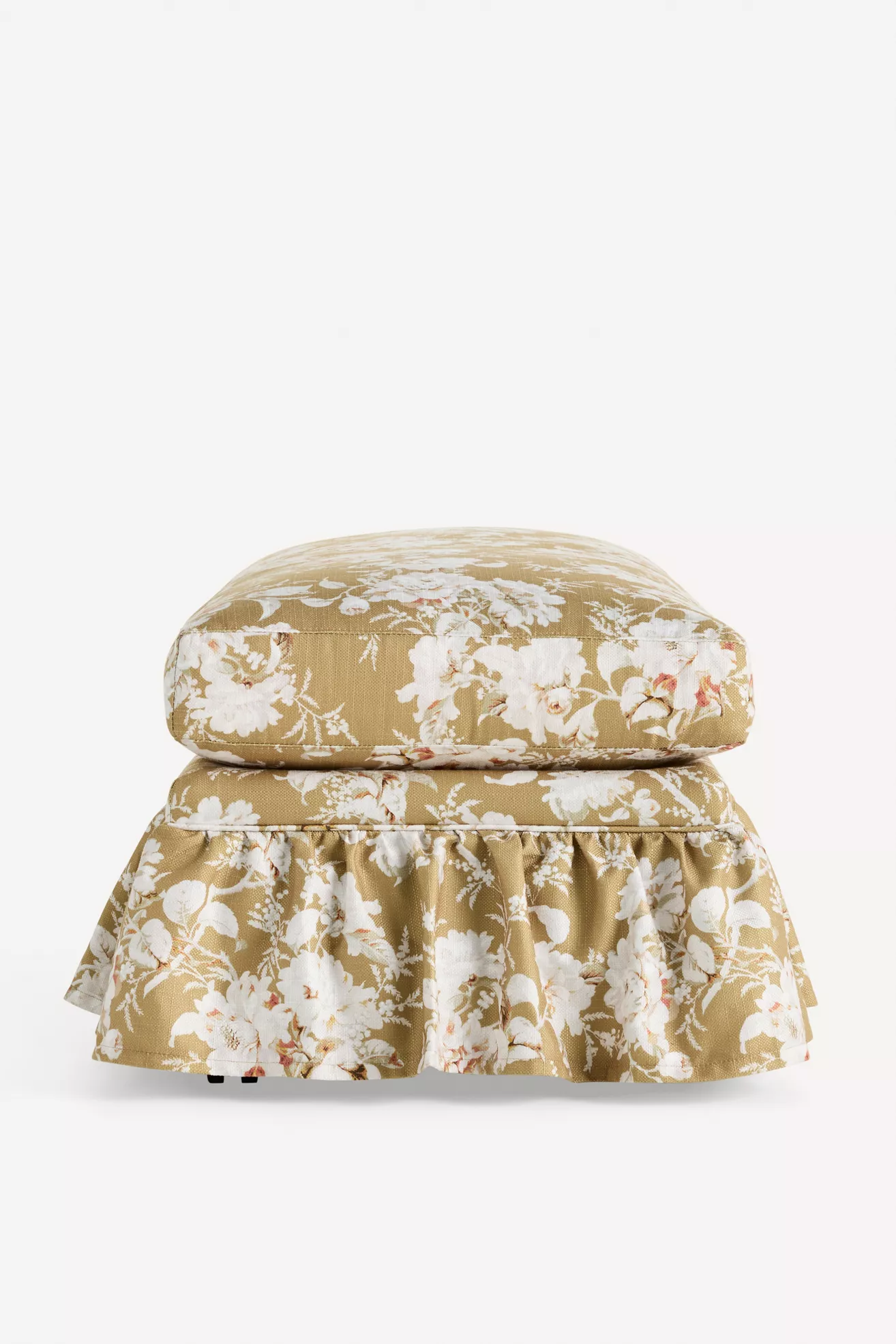 Close-up of floral upholstery and ruffle base
