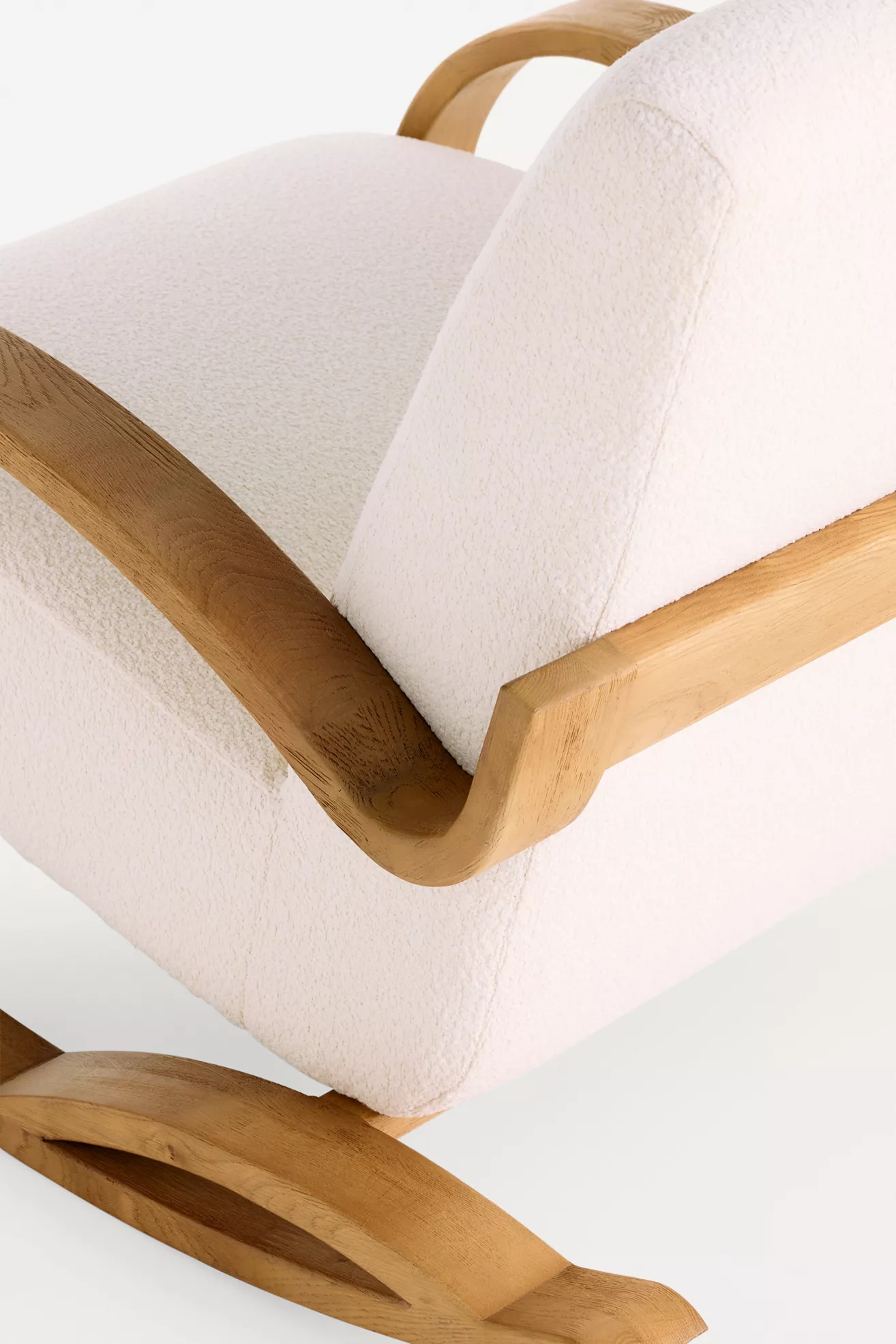 Close-up of wooden armrest and upholstery texture