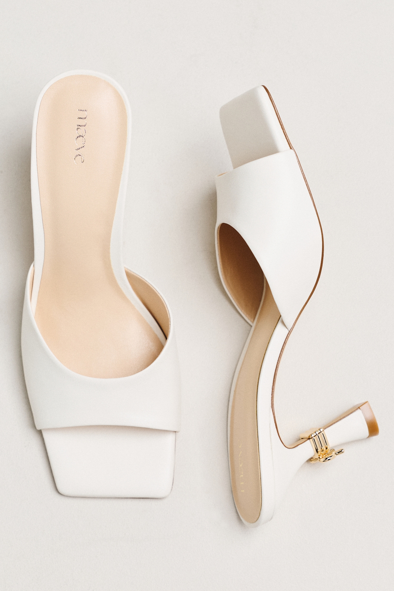 Maeve Metal Bow Open-Toe Mule Heels