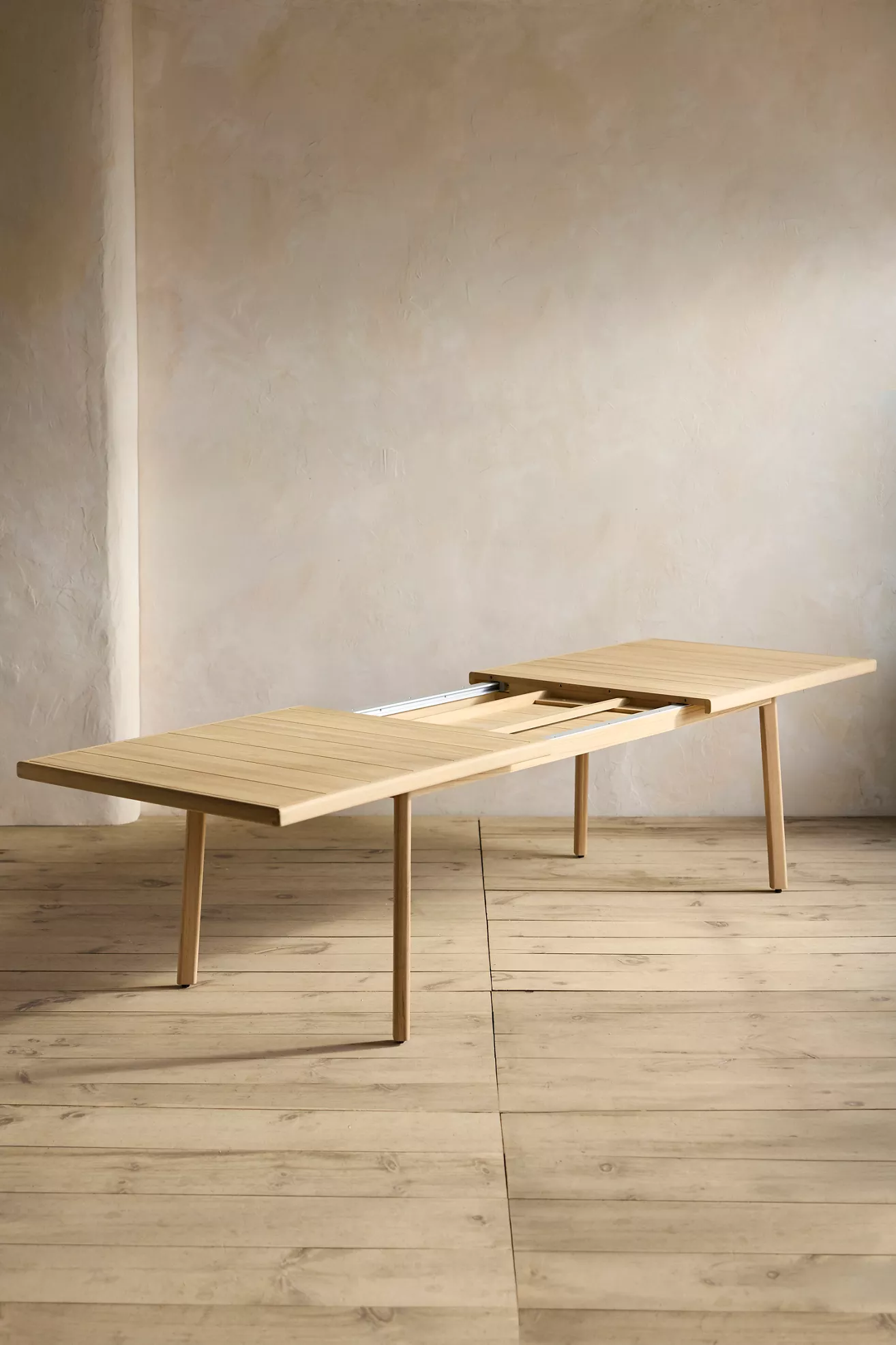 Grove Teak extension dining table fully extended with leaf