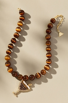 By Anthropologie Festive Beaded Drink Charm Necklace In Brown