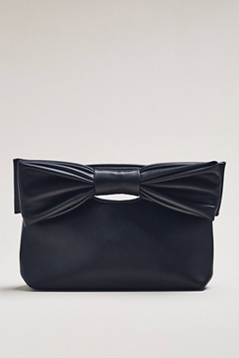 By Anthropologie Cutout Handle Bow Clutch In Black