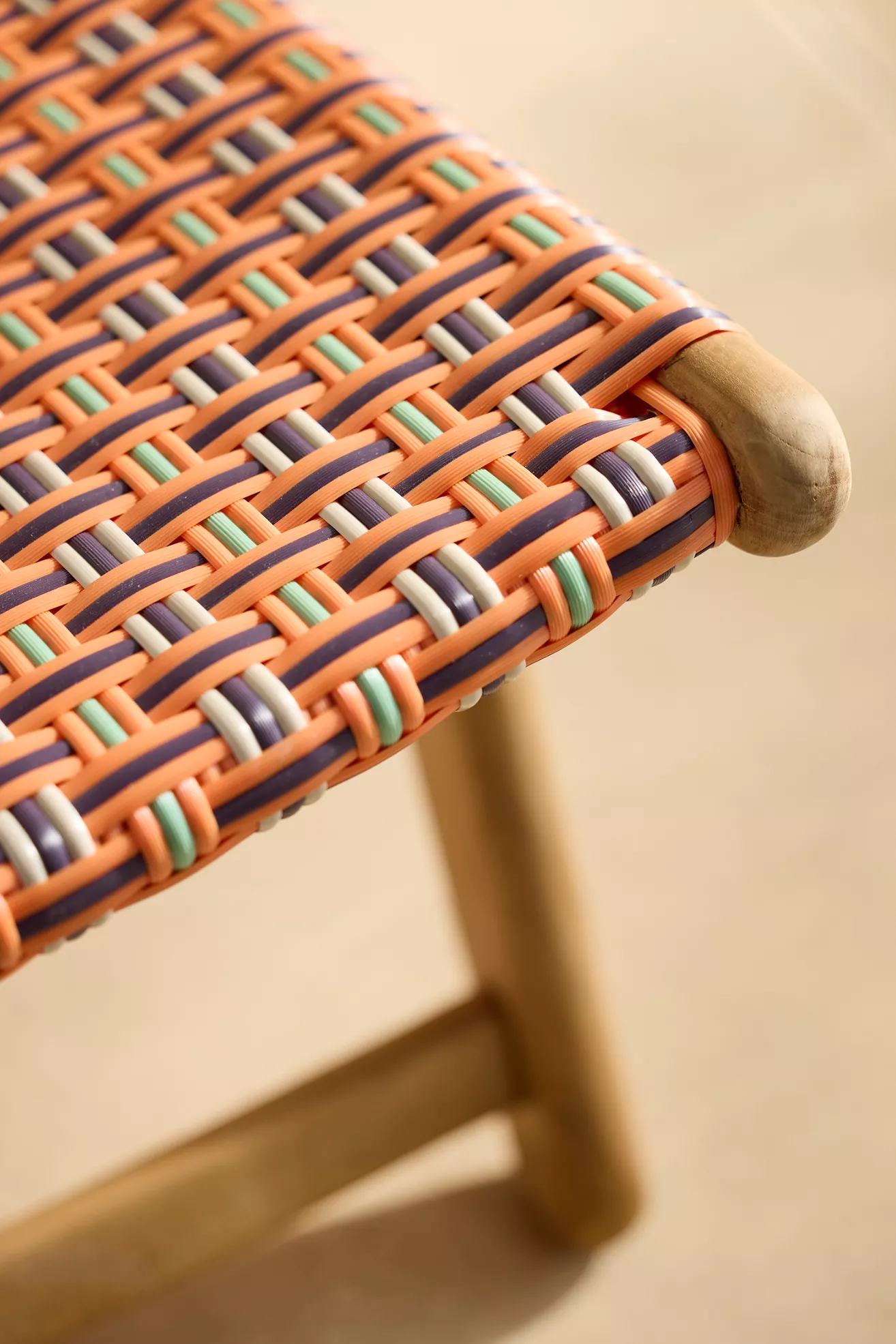 Close-up of woven seat detailing with multicolor strands