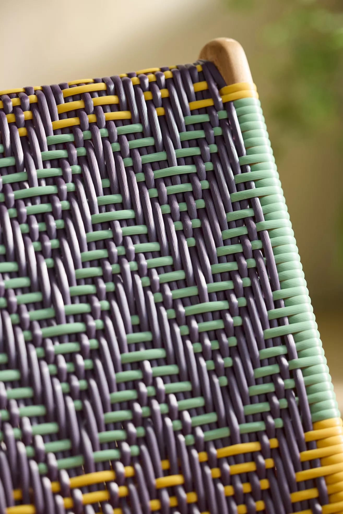 Close-up of chair corner showing woven pattern and edge
