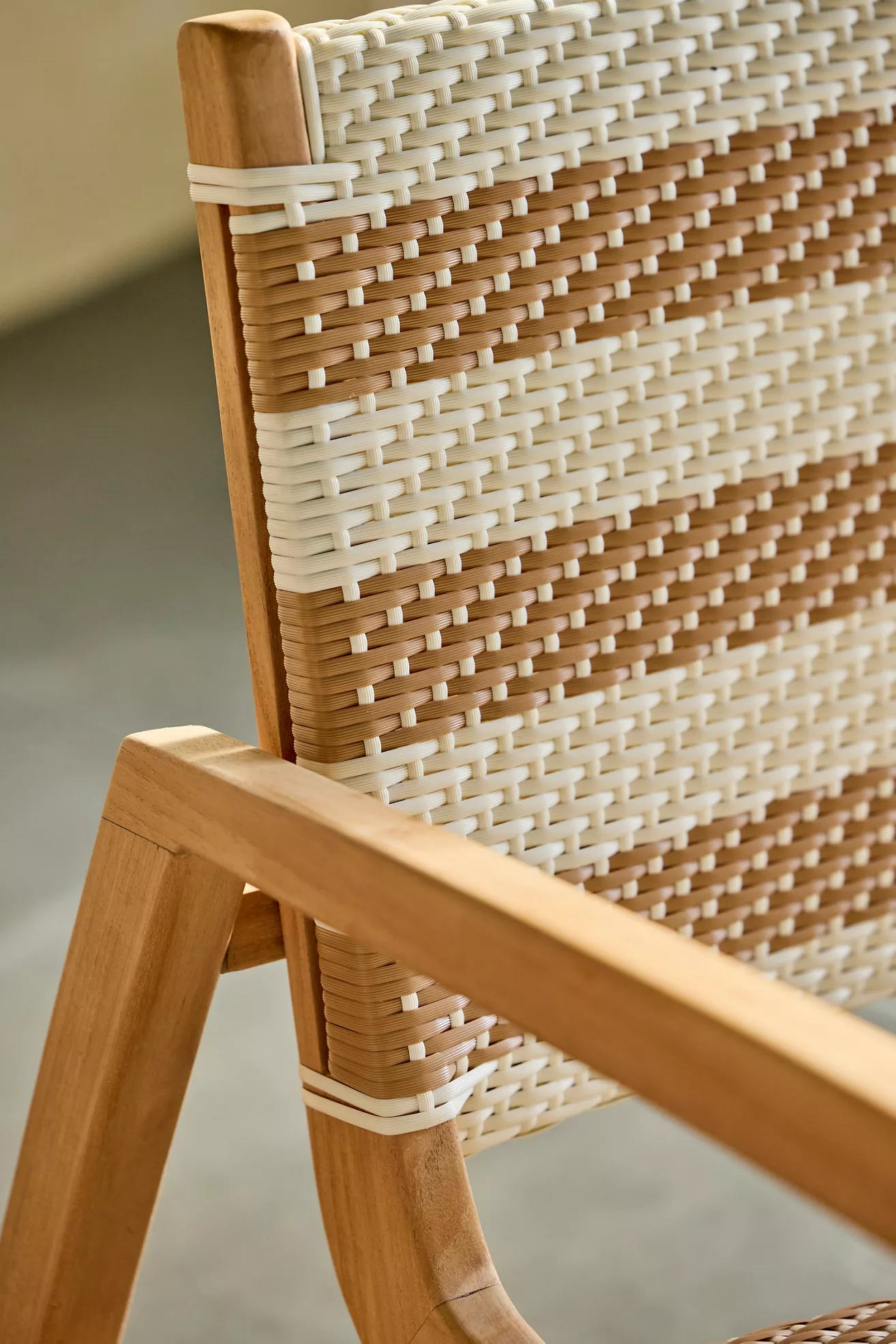 Close-up of wicker weaving on sofa with wooden frame