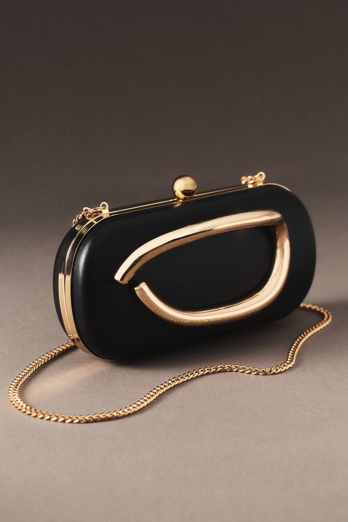 Black clutch with gold brass accent frame for weddings