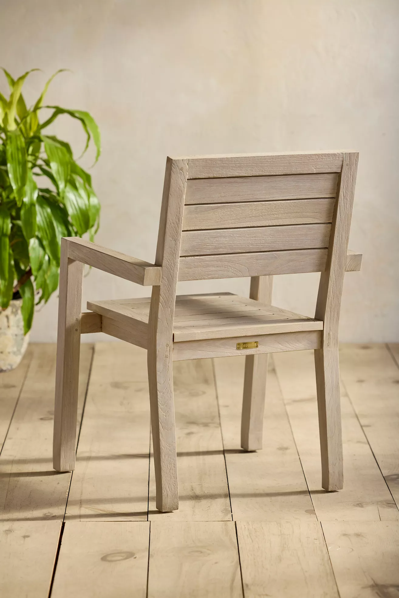 Rear/side view of slatted teak chair