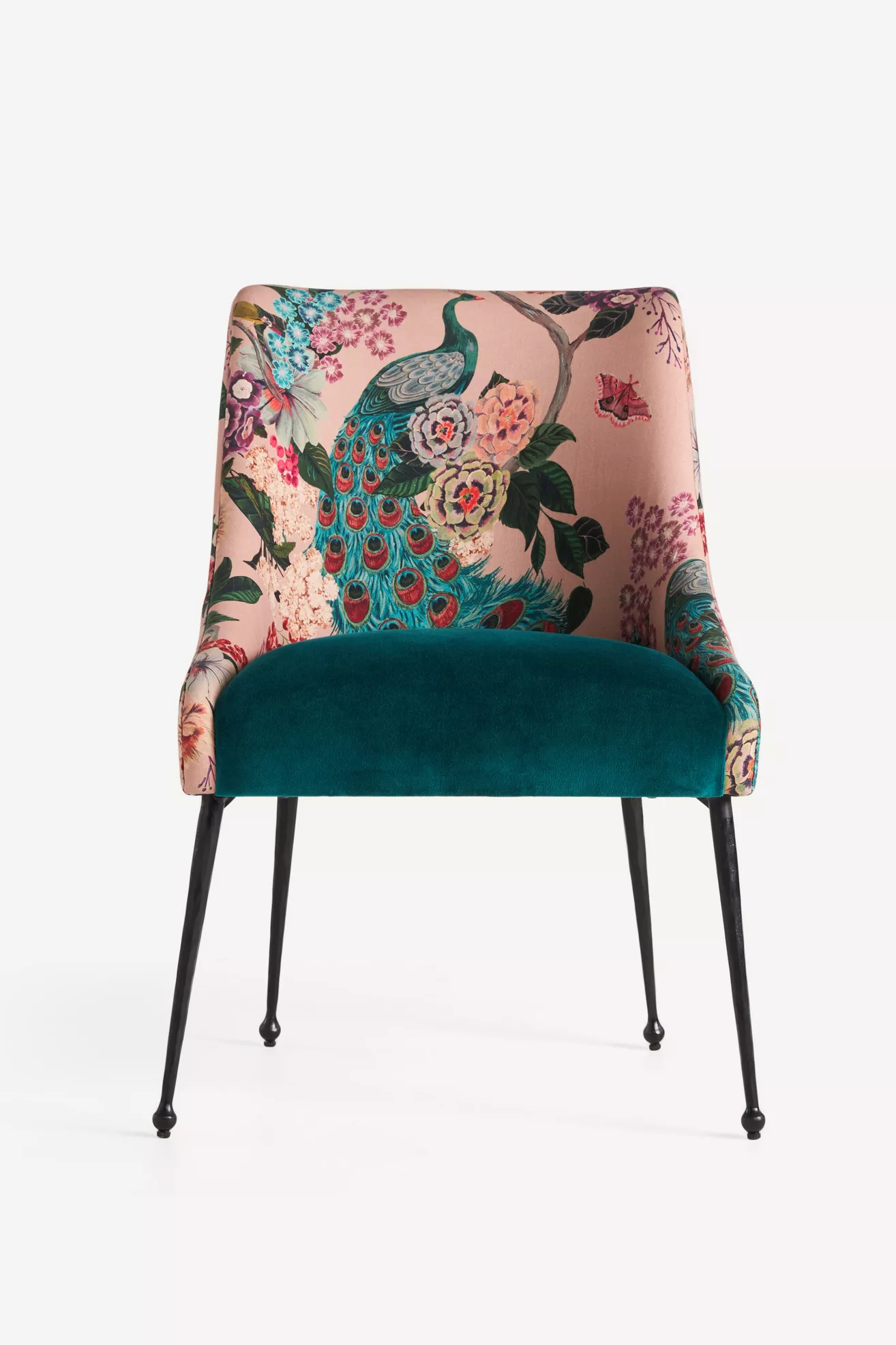 Close-up of pink floral velvet chair showing back and teal seat