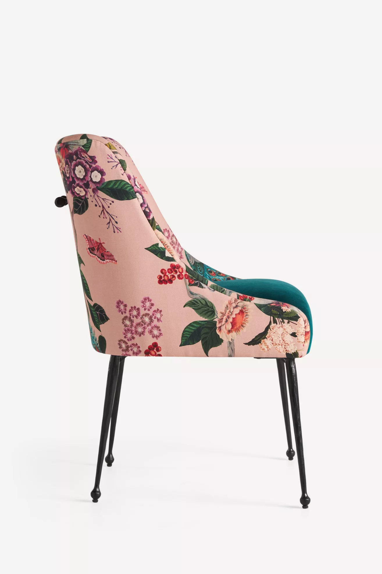 Side view of pink floral velvet chair showing profile