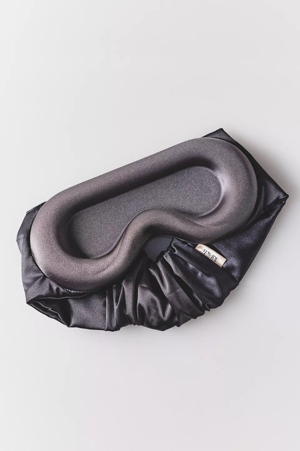 A black contoured eye mask