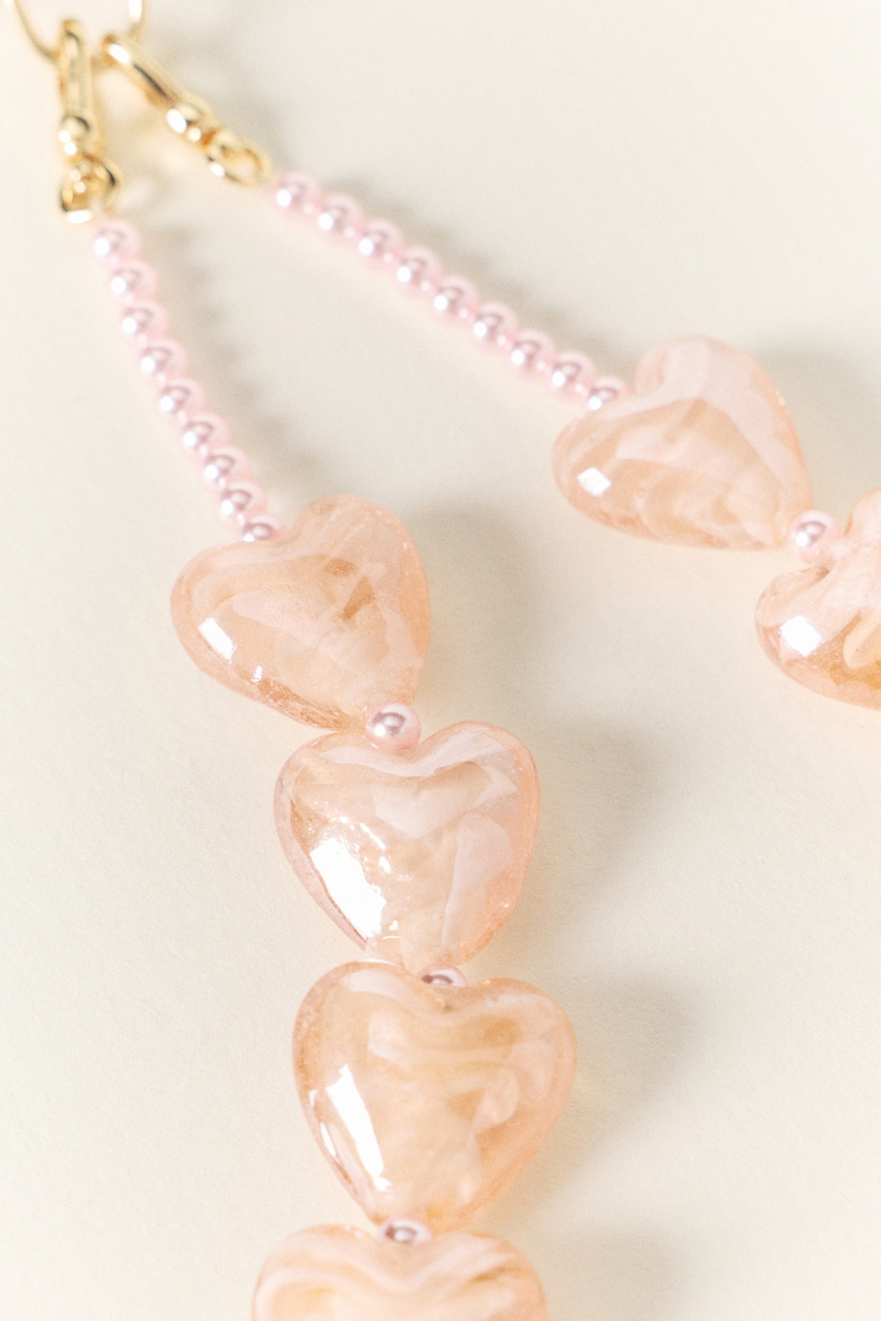 By Anthropologie Heart Icon Beaded Phone Chain