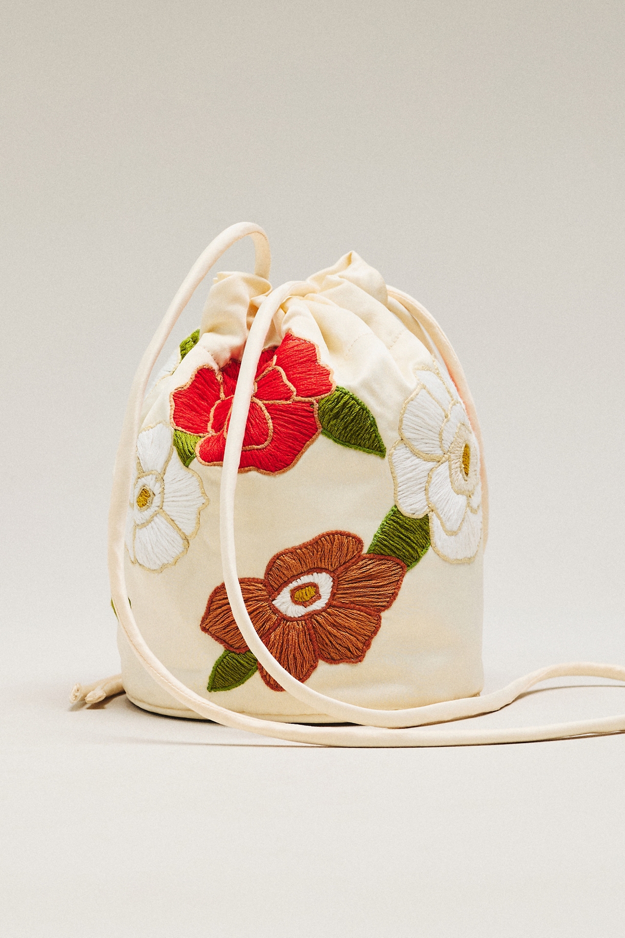 THE GREAT. Embroidered Cinched Bucket Bag