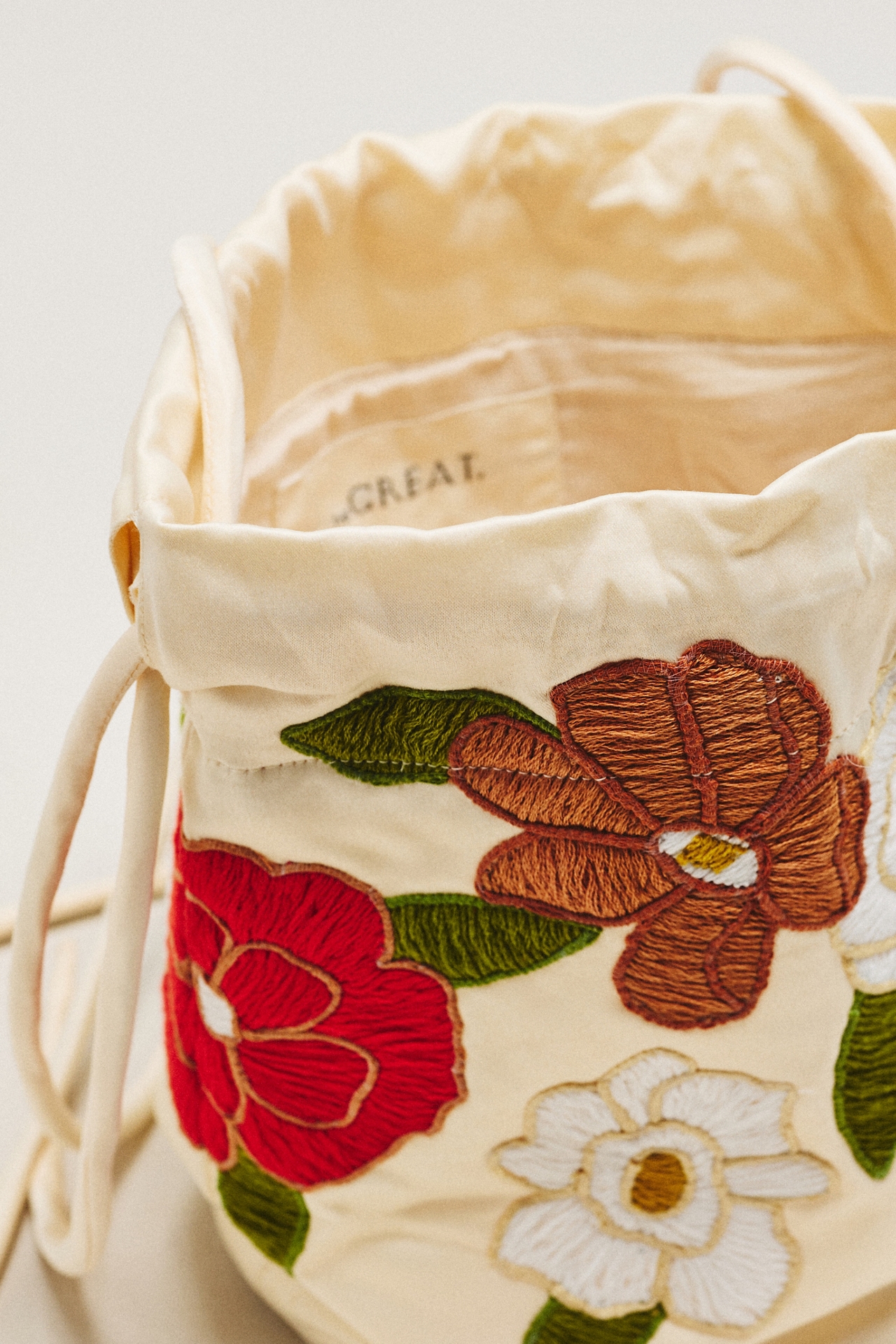 THE GREAT. Embroidered Cinched Bucket Bag