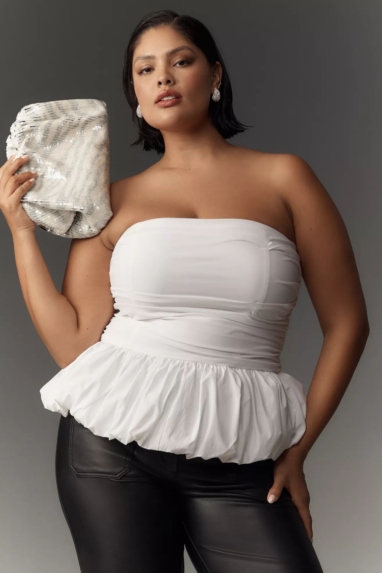 A plus-size, white, peplum tube top