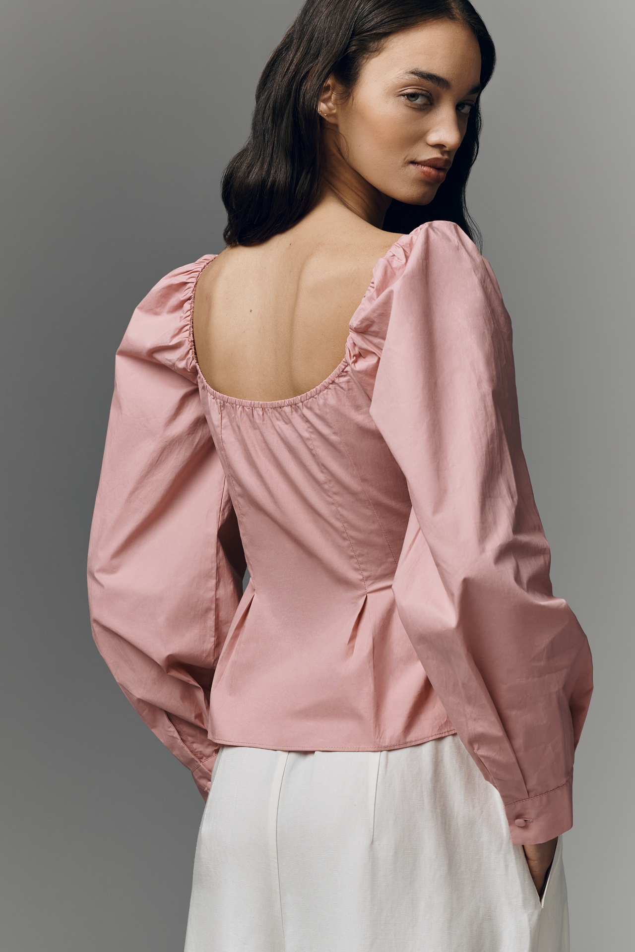 NIA Cloverfield Peplum Long-Sleeve Top