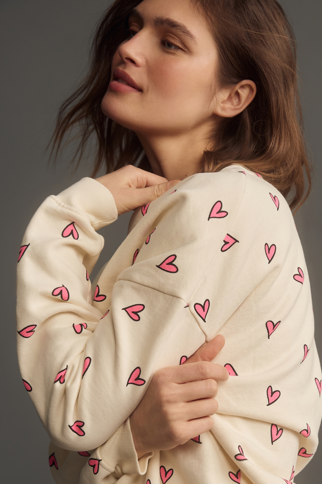 KULE The Oversized Allover Heart Sweatshirt