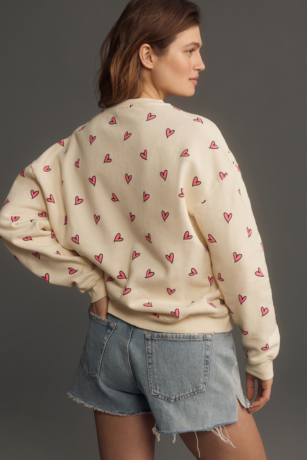 KULE The Oversized Allover Heart Sweatshirt