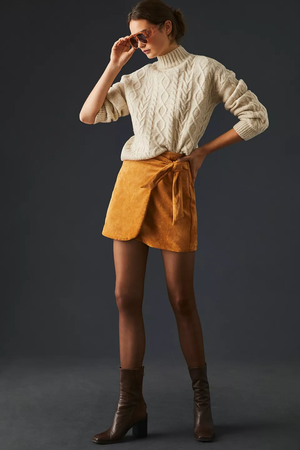 Cable-knit sweater with mini skirt for brunch