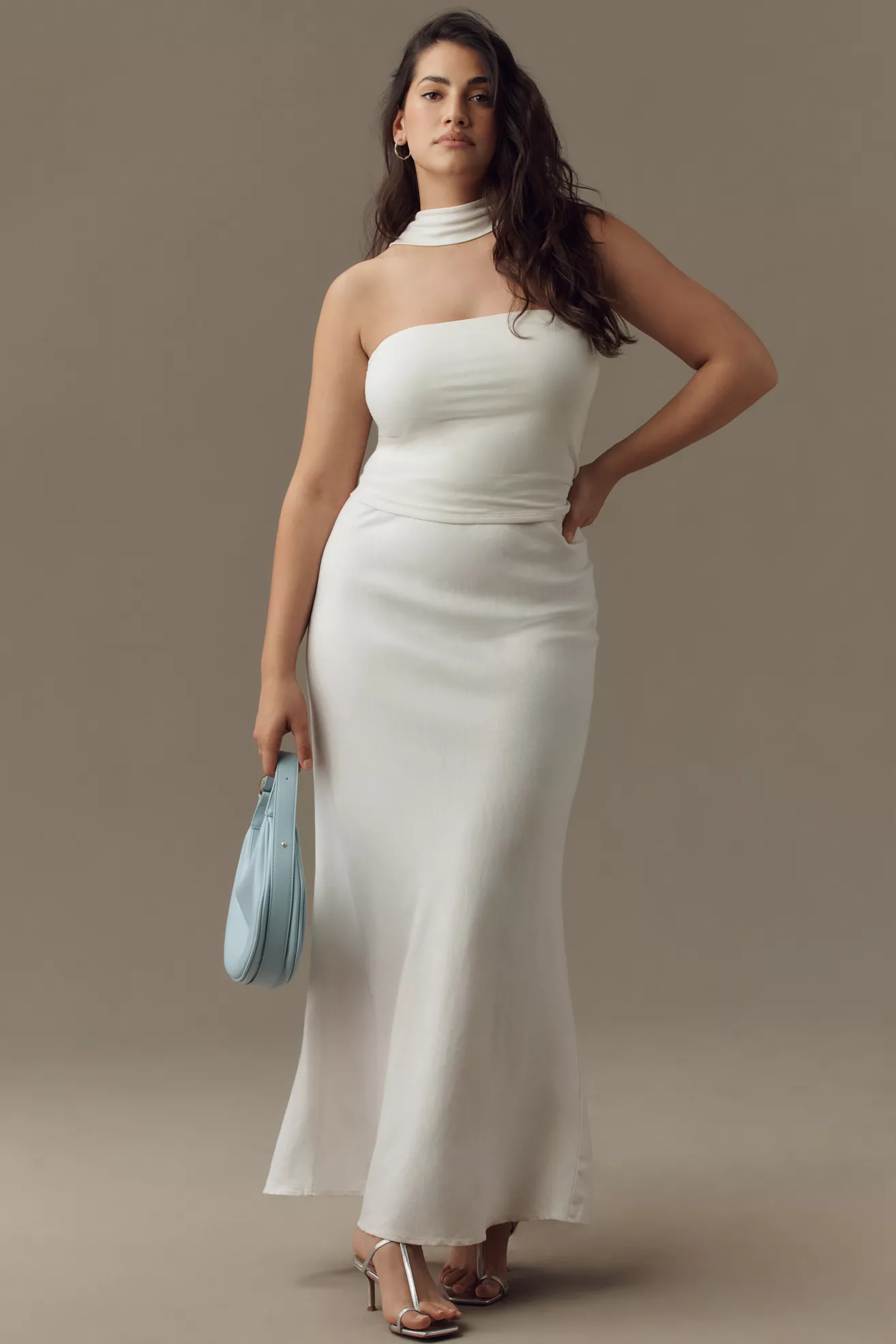 A plus-size, white, fitted maxi skirt
