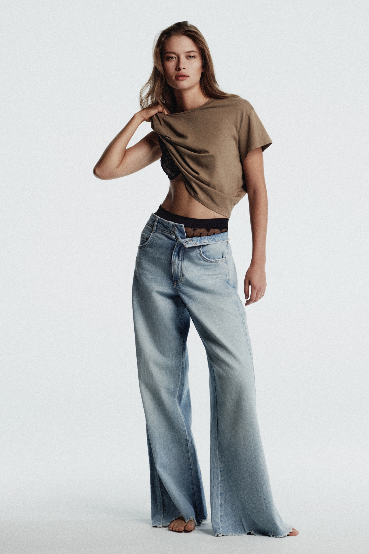 The Adi Mid-Rise Frayed Relaxed Flare Jeans by Pilcro