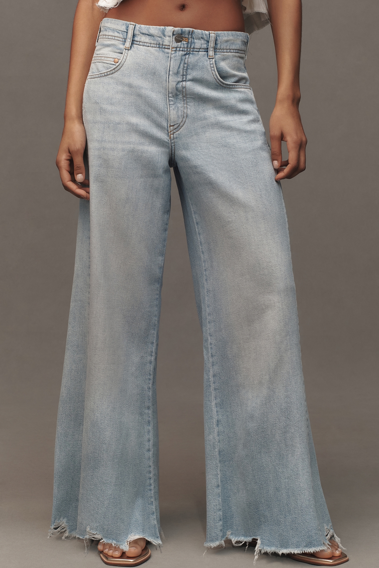 The Adi Mid-Rise Frayed Relaxed Flare Jeans by Pilcro