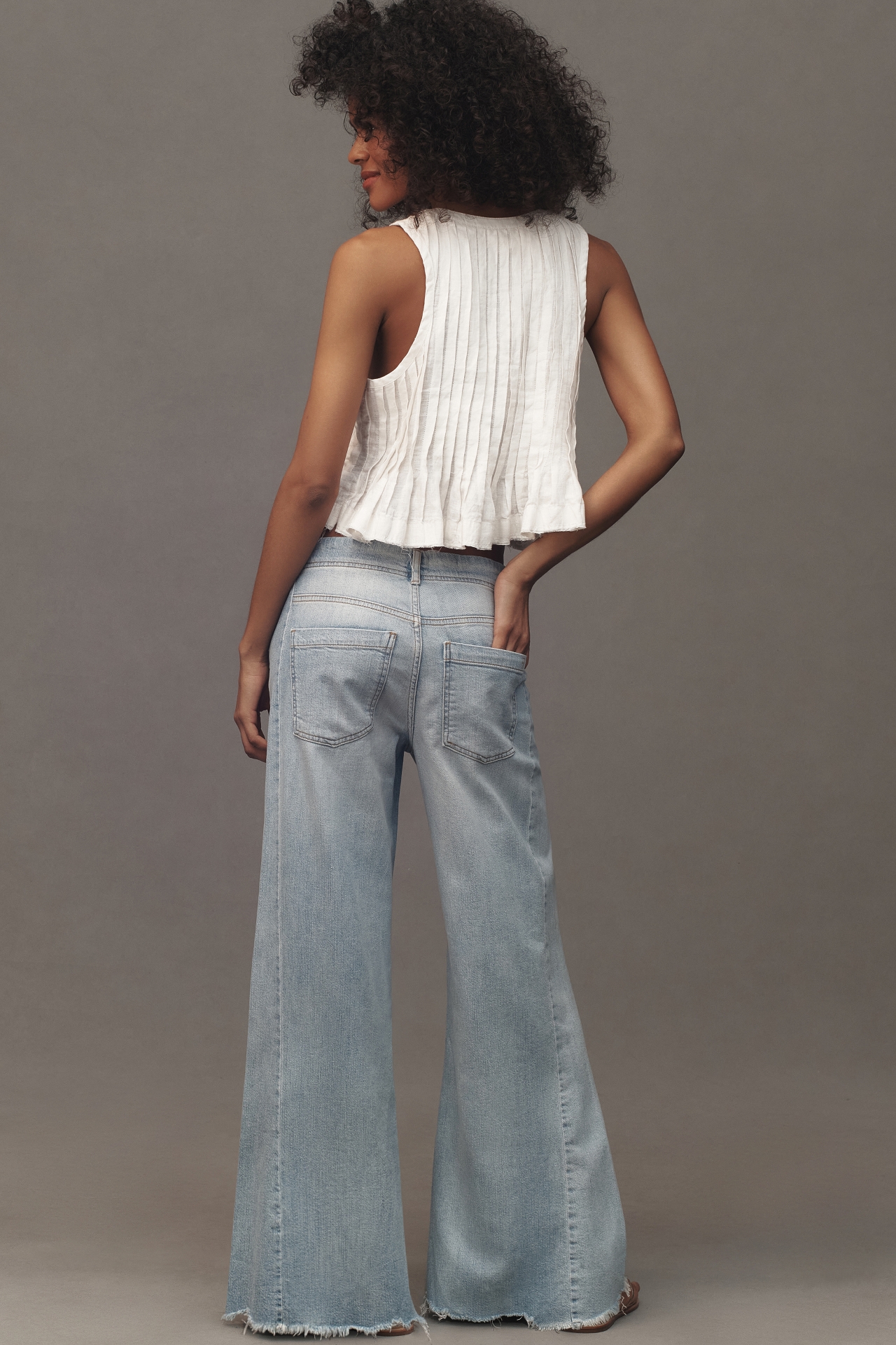 The Adi Mid-Rise Frayed Relaxed Flare Jeans by Pilcro