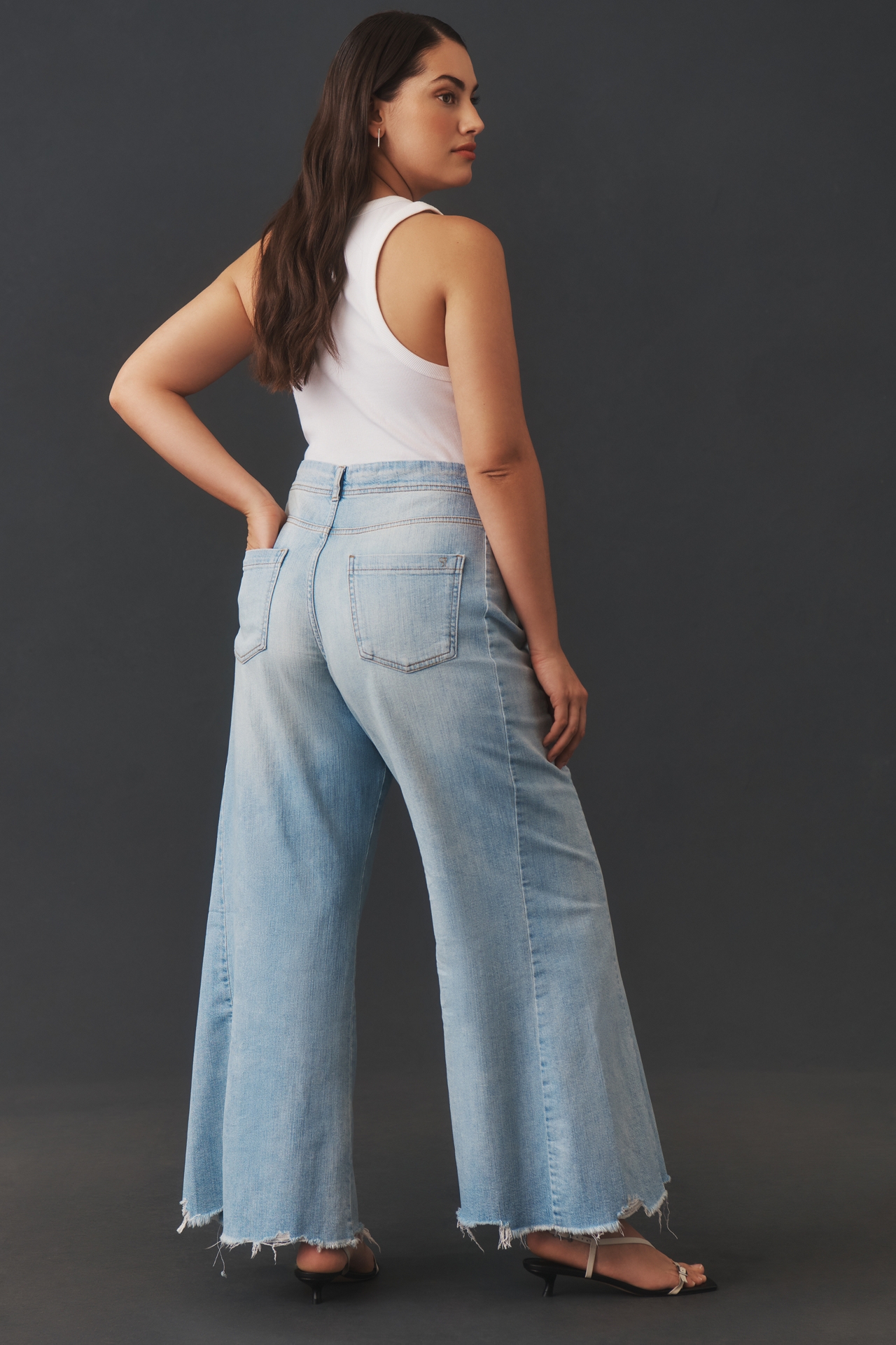 The Adi Mid-Rise Frayed Relaxed Flare Jeans by Pilcro