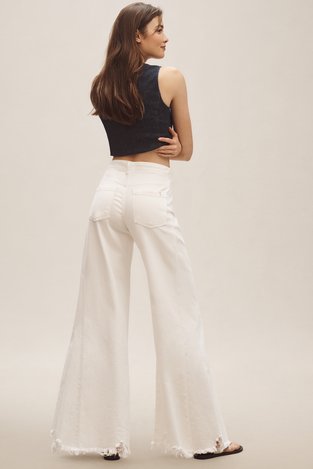 The Adi Mid-Rise Frayed Relaxed Flare Jeans by Pilcro