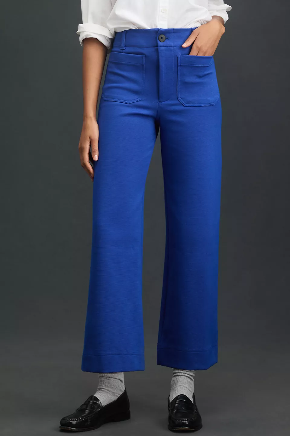 A woman wearing blue pants