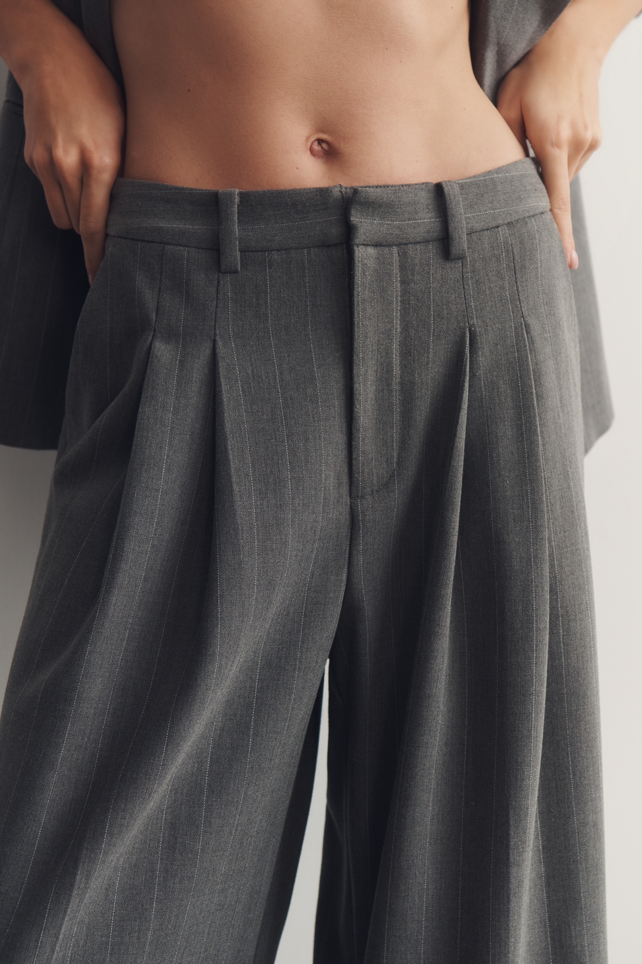 The Avery Striped Pleated Trousers by Maeve