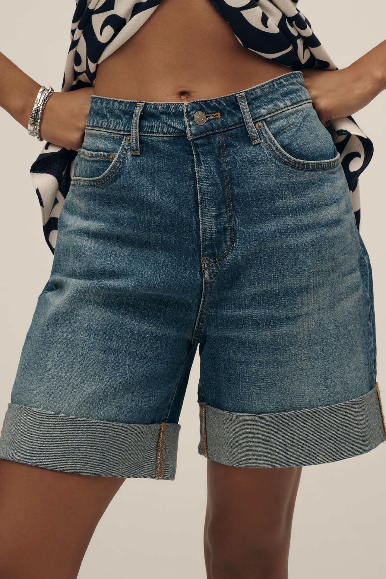 The Austyn High-Rise Cuffed Jean Shorts by Pilcro